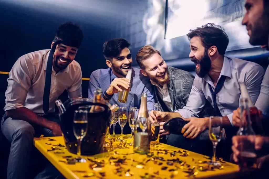 Group of friends celebrating a bachelor party in Mexico City, with iconic landmarks and vibrant cityscape in the background.