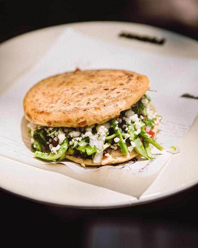 A golden grilled tortilla filled with fresh ingredients